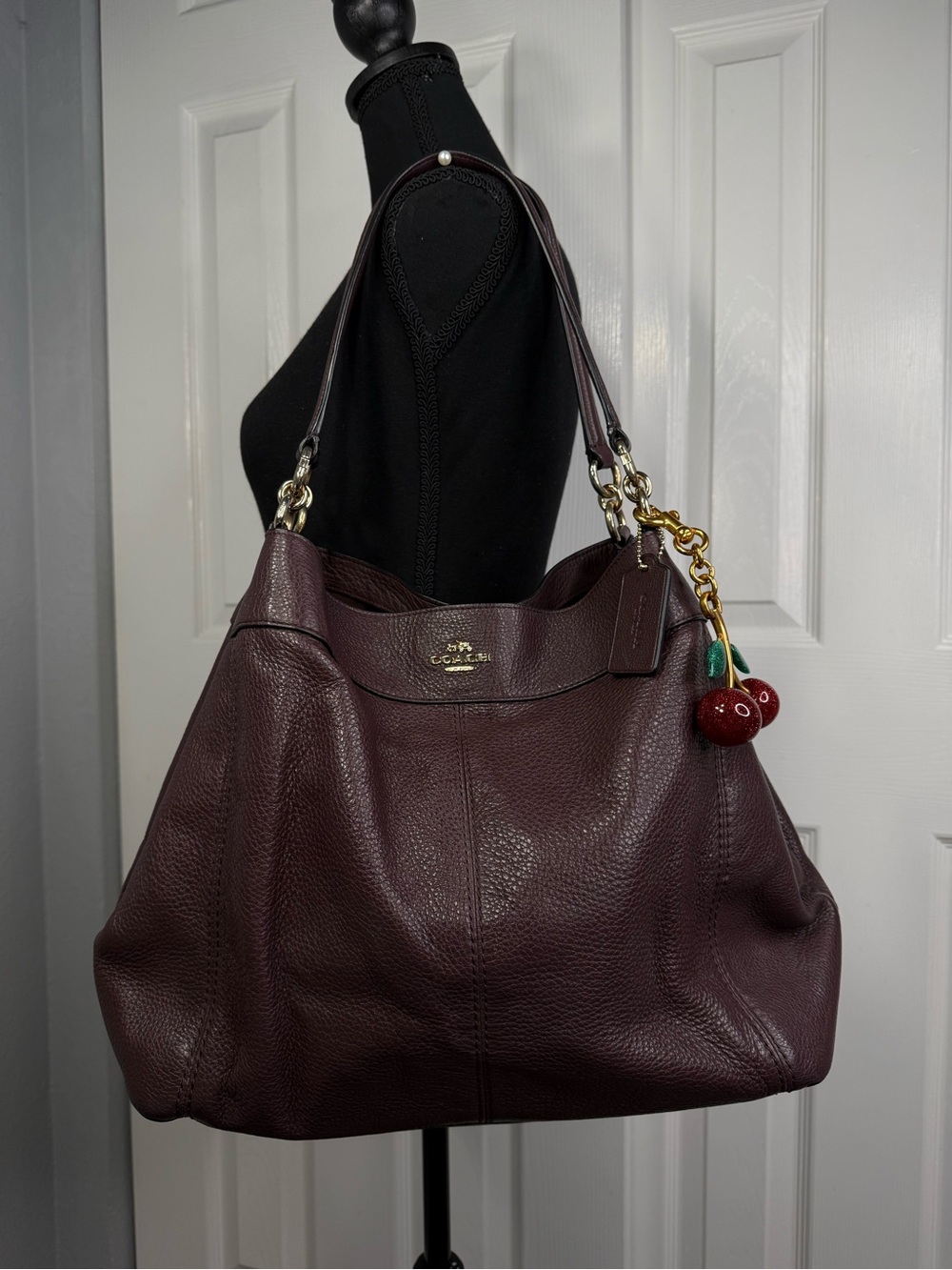 Coach Burgundy Pebbled Leather Shoulder Bag with Cherry Charm